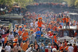 Amsterdam canals filled with orange during King’s Day celebrations